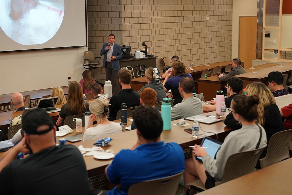 An image of Dr. Bicos speaking during the IPE